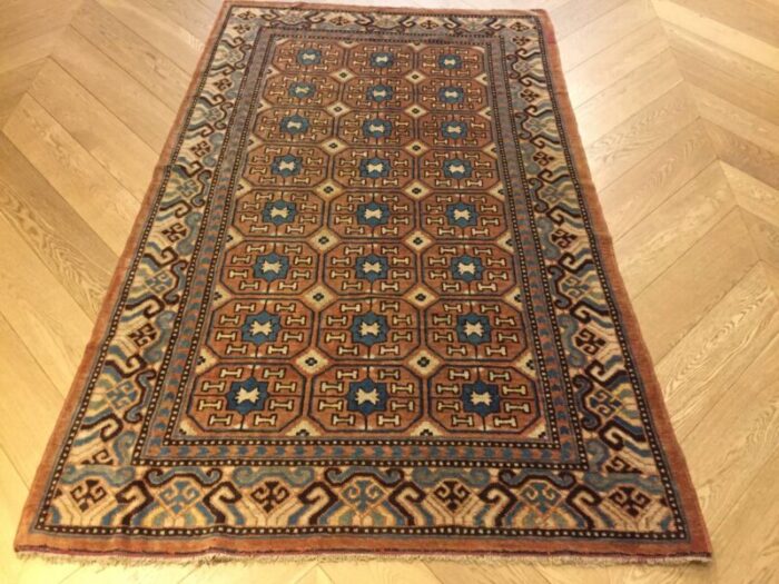 antique chinese brown and blue khotan rug 1870s 1