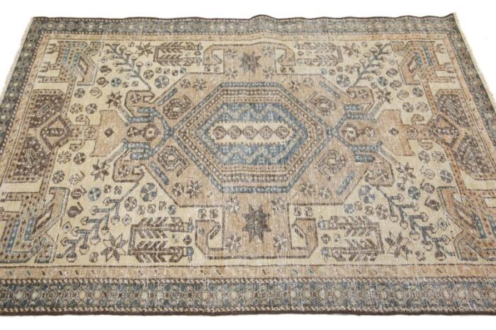 beige vintage persian distressed wool rug with allover pattern 2942