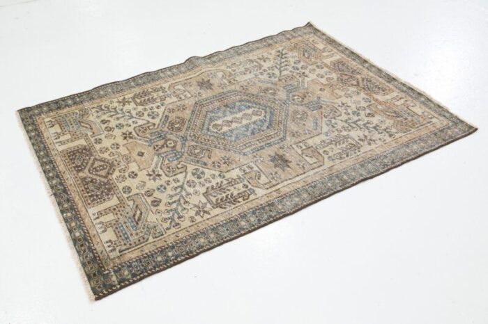 beige vintage persian distressed wool rug with allover pattern 4659