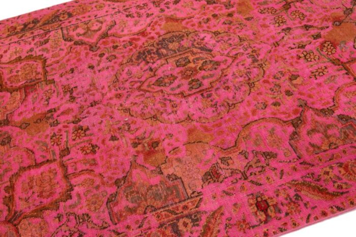 vintage overdyed persian wool rug in pink with floral motif 0924