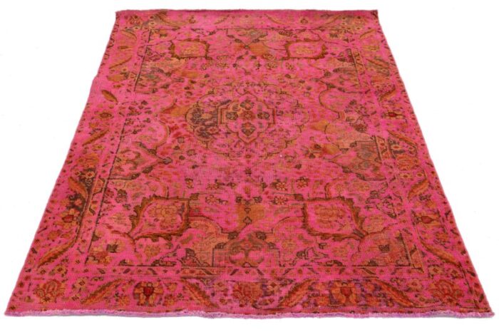 vintage overdyed persian wool rug in pink with floral motif 0932