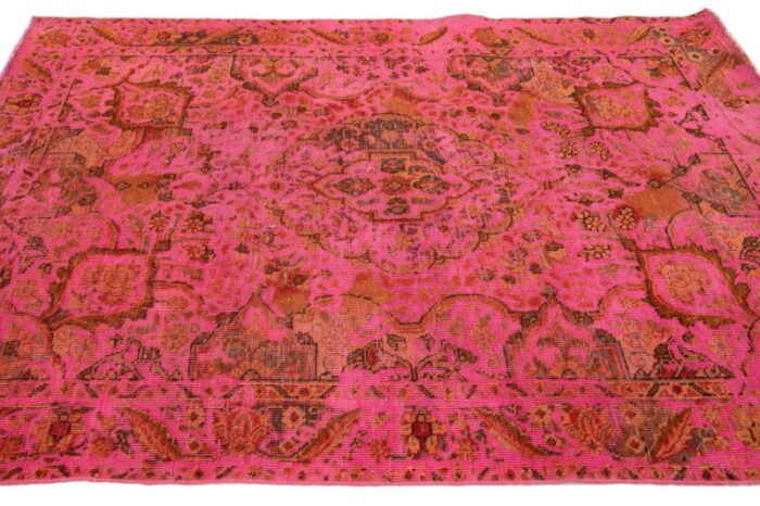 vintage overdyed persian wool rug in pink with floral motif 9396