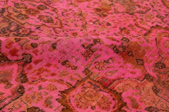 vintage overdyed persian wool rug in pink with floral motif 9686